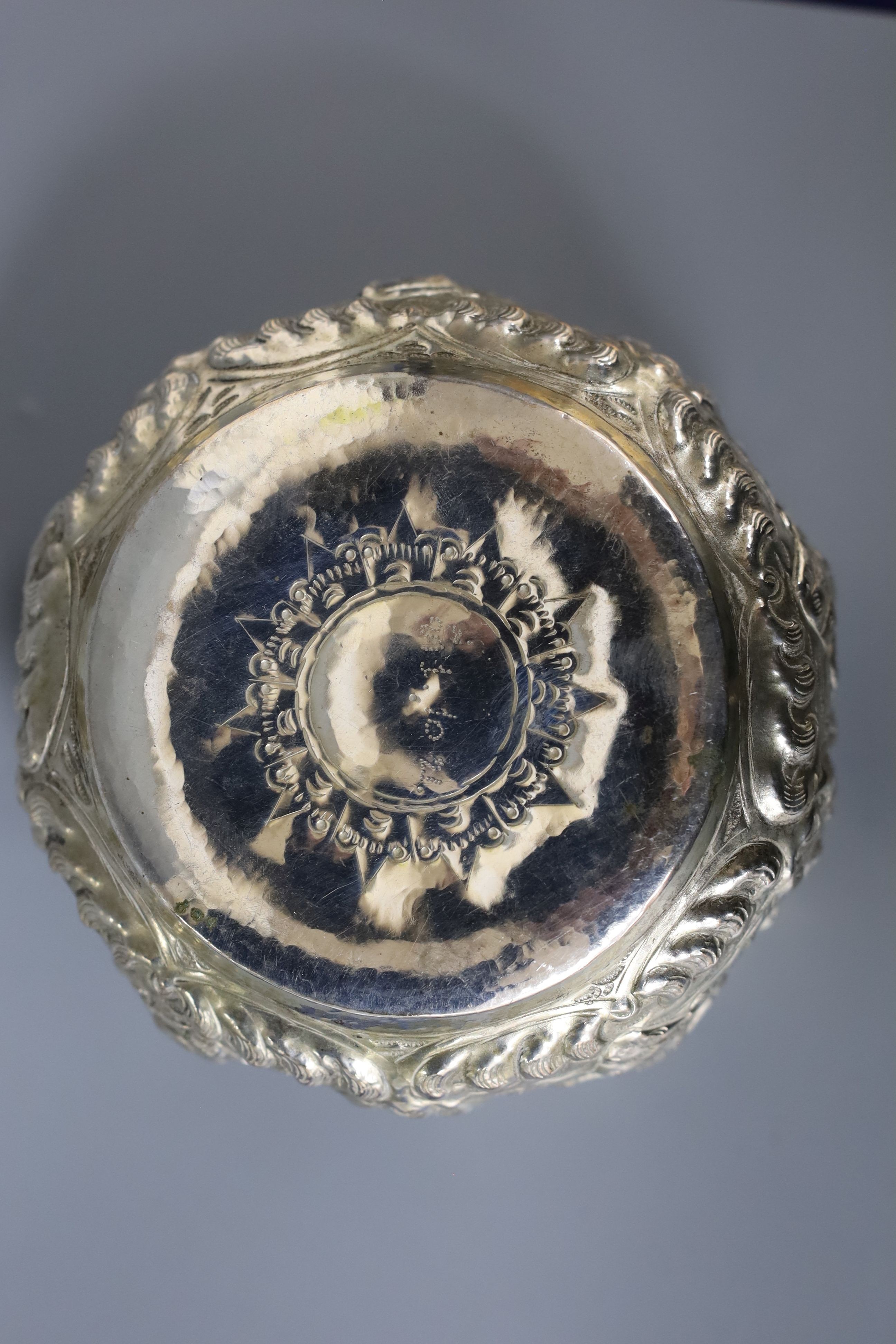 An Indian embossed white metal bowl, diameter 11.2cm, 4.5oz.